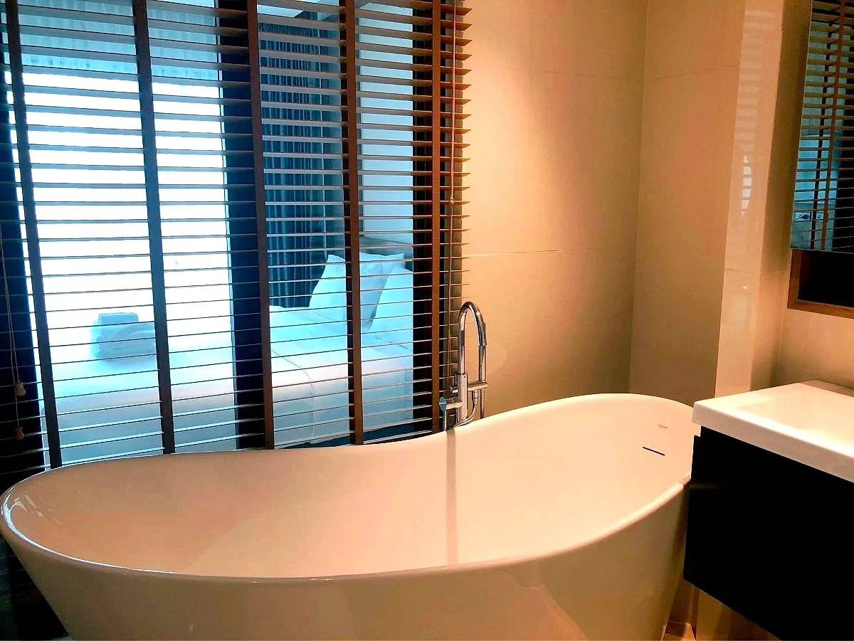 Clean private bathroom with water heater